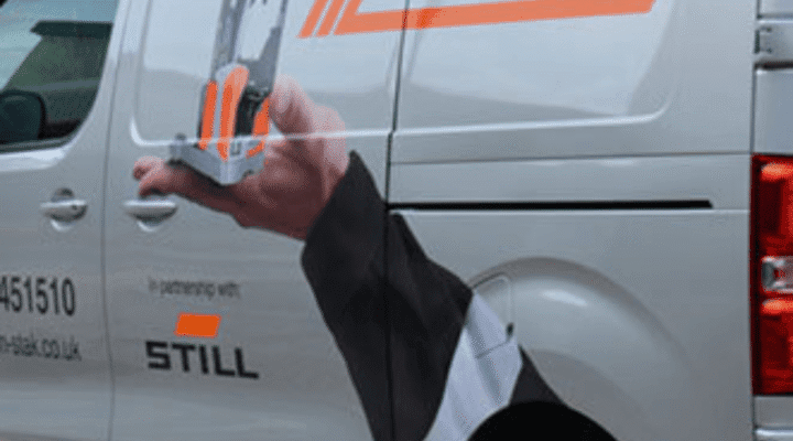 Delivery van featuring Rack-N-Stak branding and a hand holding a pallet rack, showcasing partnership with STILL.