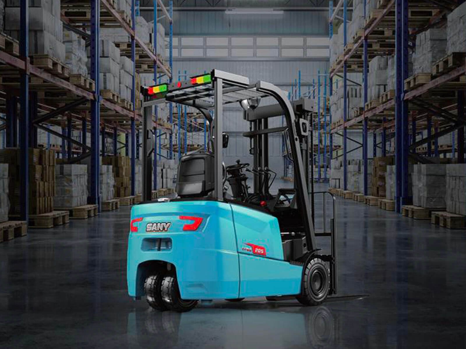 A blue electric forklift parked in a modern warehouse filled with stacked goods.